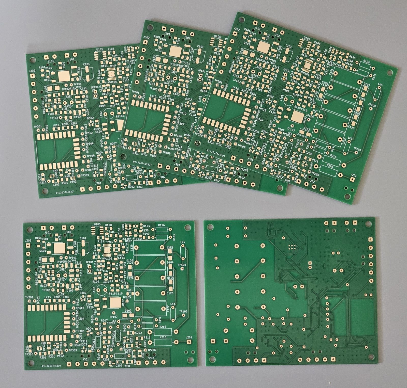 The five bare dekatron controller/PSU boards: four top side up and one bottom side up